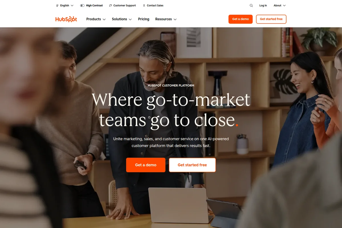 HubSpot homepage hero section showing a diverse team collaborating, highlighting the 'go-to-market' platform.