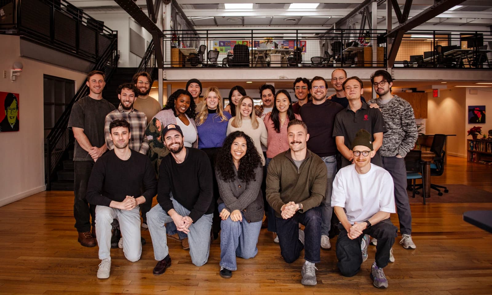 Juicebox team photo showing smiling employees in a modern office space.